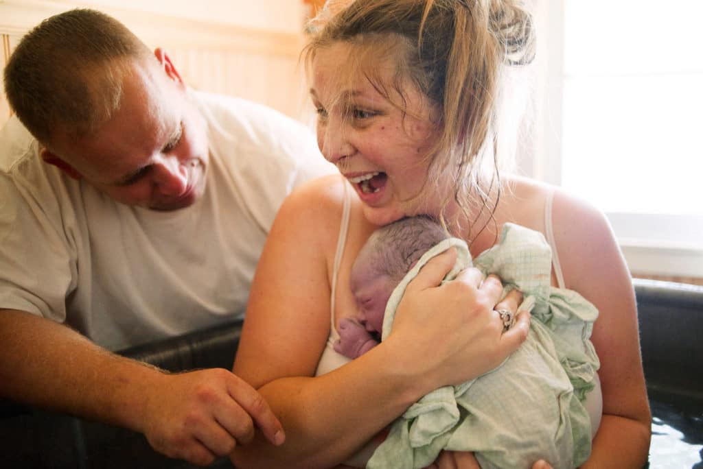 Birth is a normal life cycle event that can be joyful as shown by this mother ecstatic after the birth of her baby